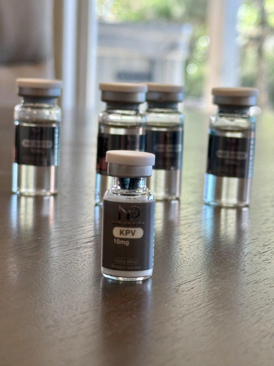 Novanta Research KPV 10mg vial lined up with other peptides on a lab bench