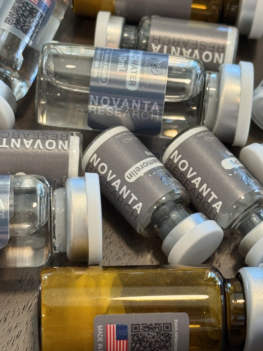 Close-up pile of Novanta Research peptide vials and bacteriostatic water
